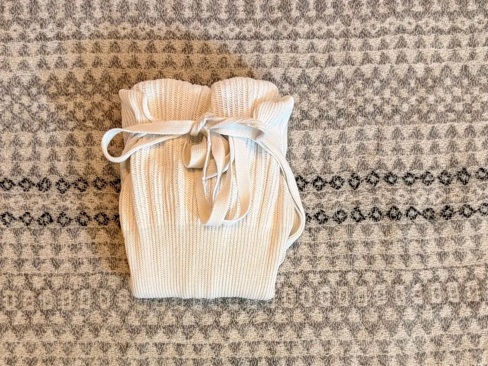 Step 10: The finished folded and tied cotton nappy, with ends tucked in.