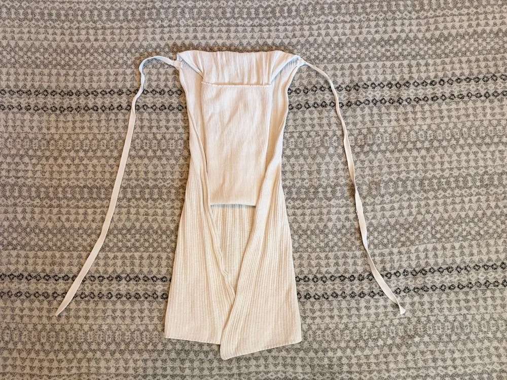 Step 4: Both sides folded inward to make the nappy narrower.
