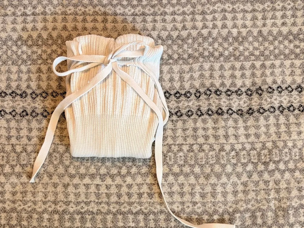 Step 9: The ties fastened in a bow across the front.